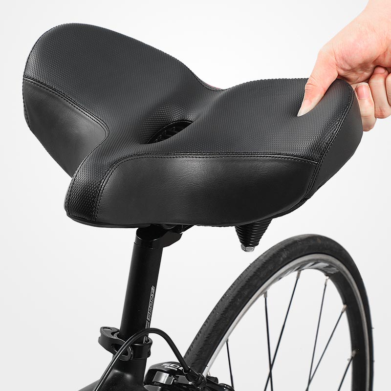 Ergonomic bike seat featuring shock absorption and a breathable surface, designed for comfort on all bike types. 0